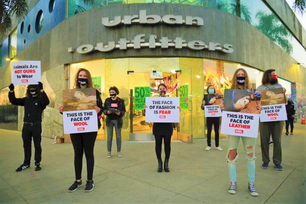 SOS students protest outside an Urban Outfitters store