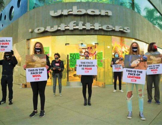 SOS students protest outside an Urban Outfitters store