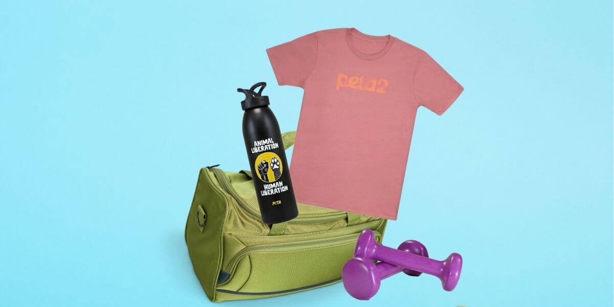 Gym bag and weights with a peta2 logo shirt and a water bottle with an "Animal Liberation" message