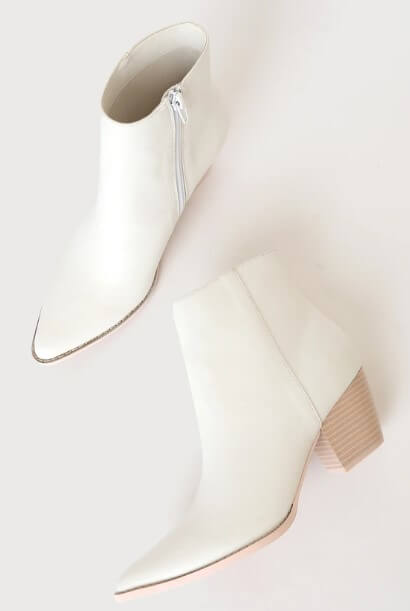 A pair of white ankle boots