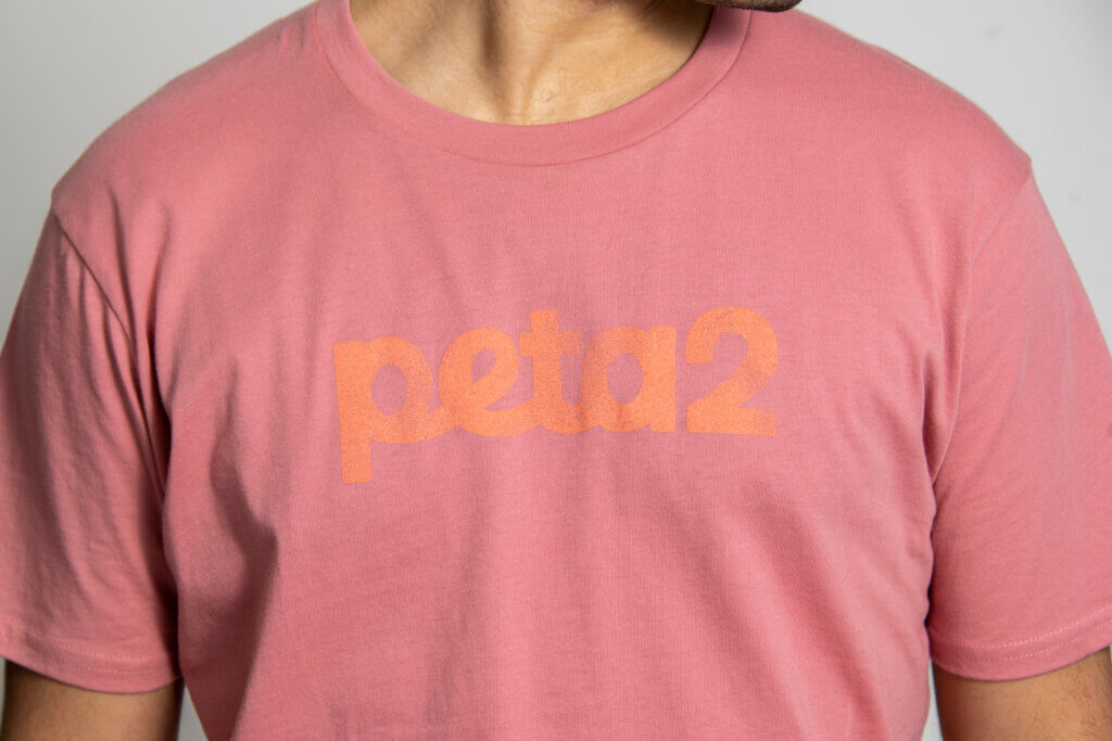 Close-up of the peta2 logo on the front of a shirt