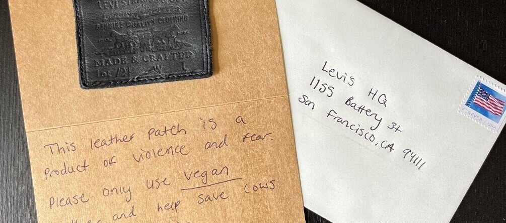 A handwritten note and envelope with a Levi's jean patch