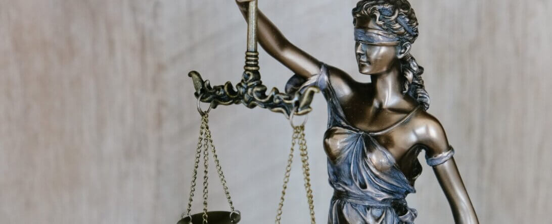 Image from Unsplash of the scales of justice