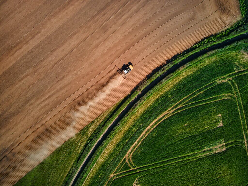 Image from Unsplash of a tractor in a field