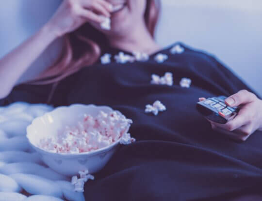 Image from Unsplash of someone watching a movie