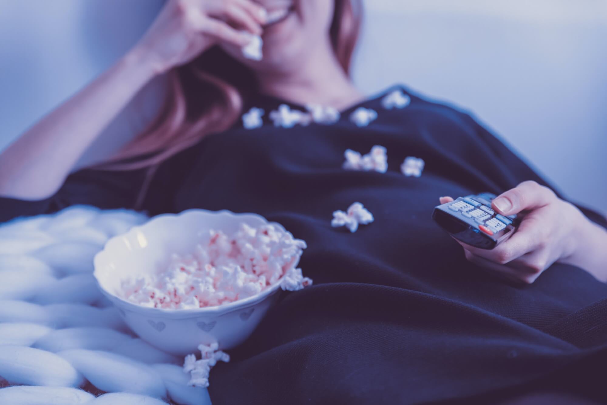 Image from Unsplash of someone watching a movie