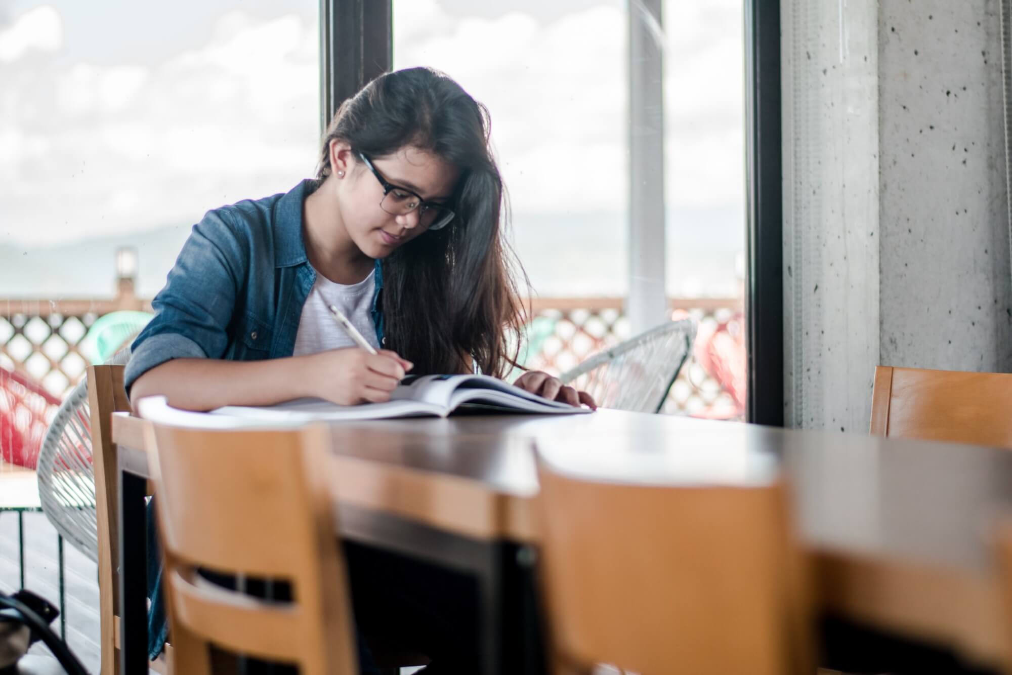 Image from Unsplash of a person writing