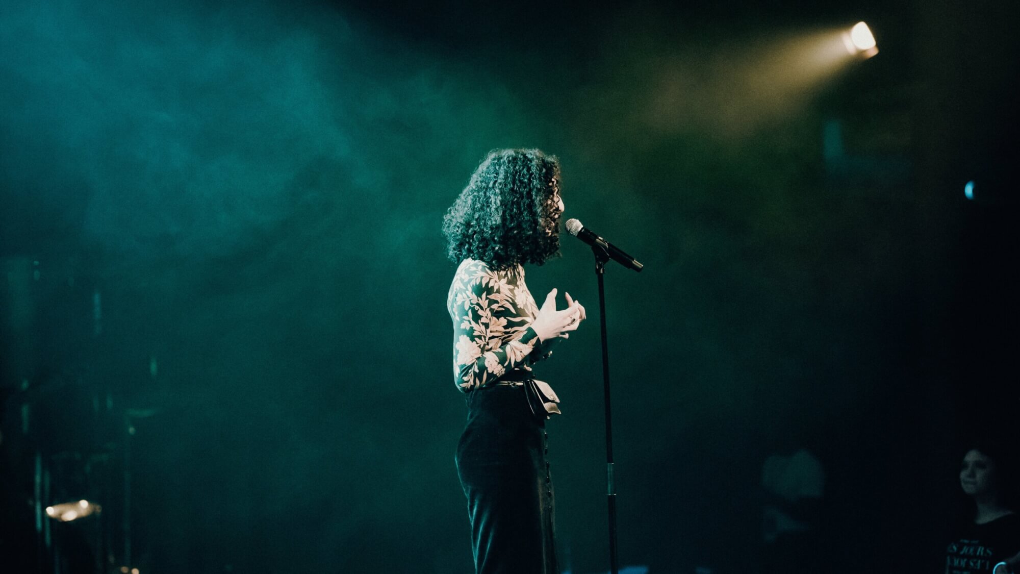 Image from Unsplash of a poetry slam for the spoken word featured image