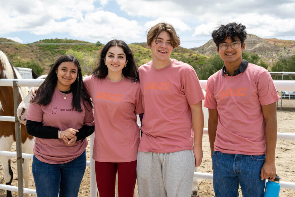 Group of students wearing peta2 t-shirt at Gentle Barn