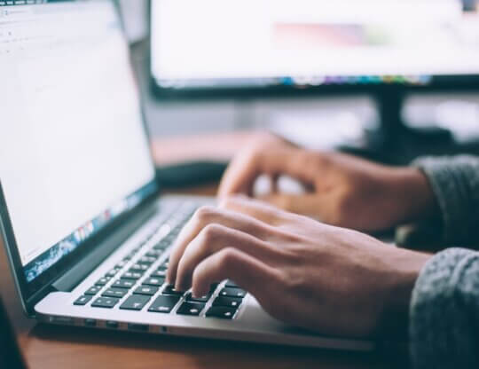 Image from Unsplash of a person writing for the featured image for Letters to the Editor