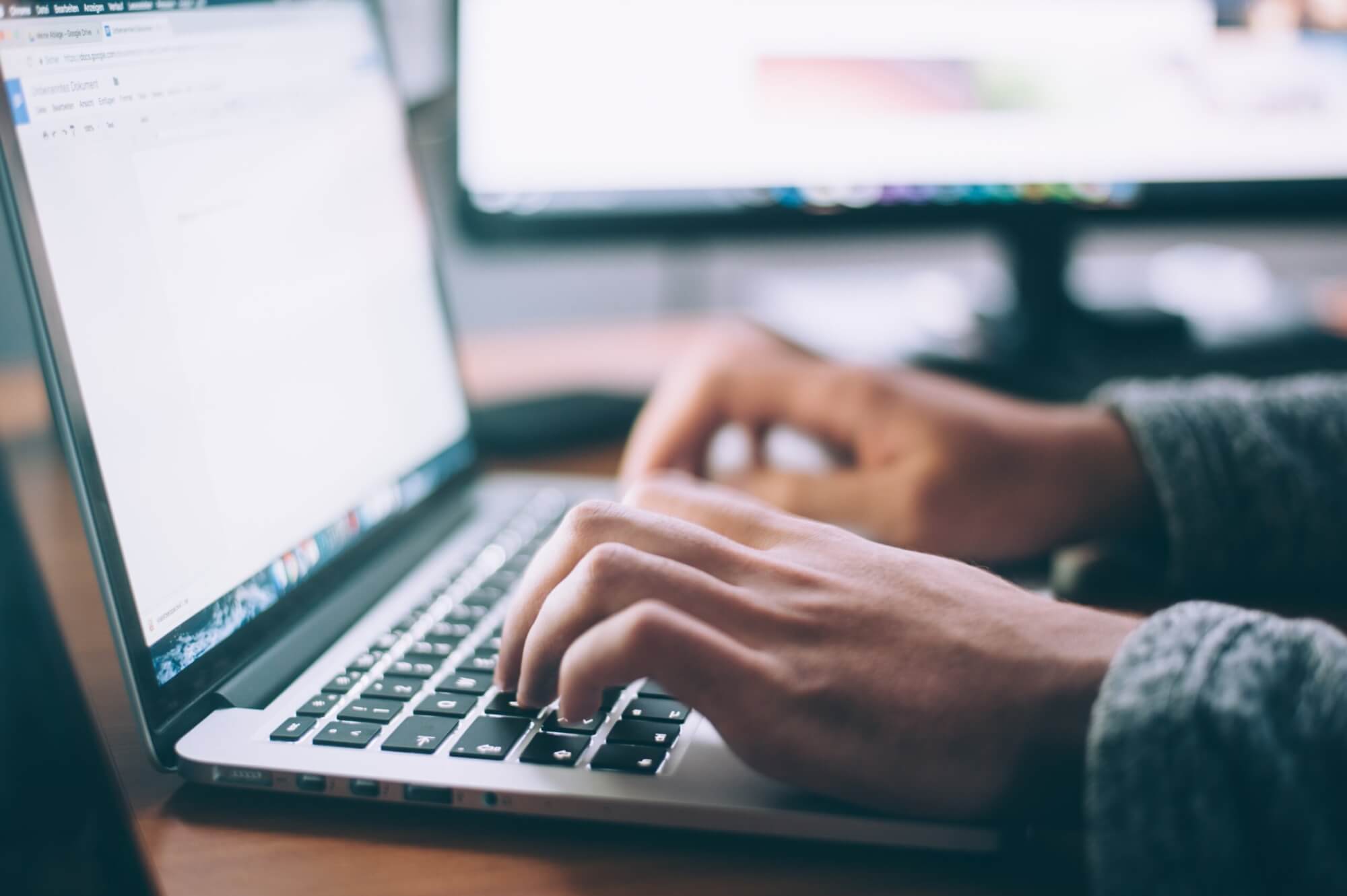 Image from Unsplash of a person writing for the featured image for Letters to the Editor